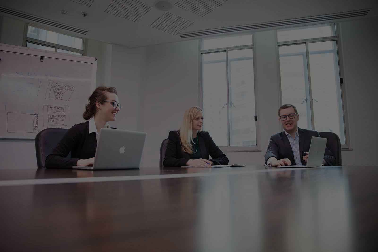 Three website professionals in Sydney CBD office