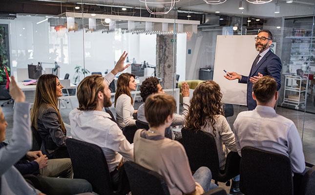 Professionals in Sydney office discussing a business case