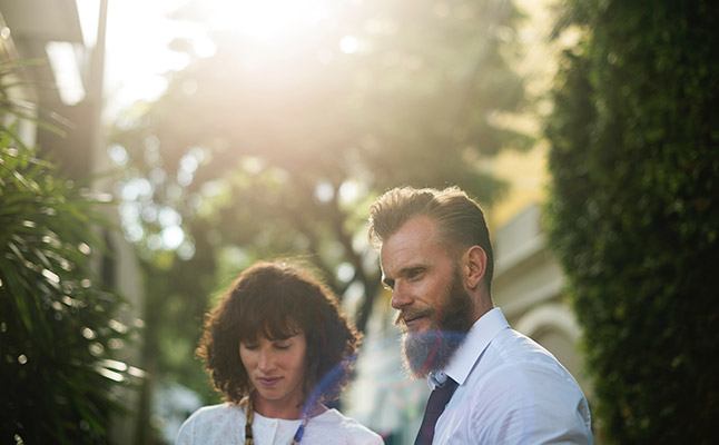 Professionals in Sydney office discussing a business case