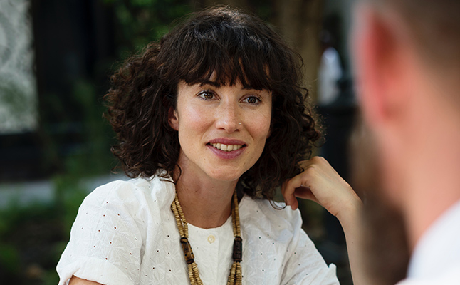 Professionals in Sydney office discussing a business case