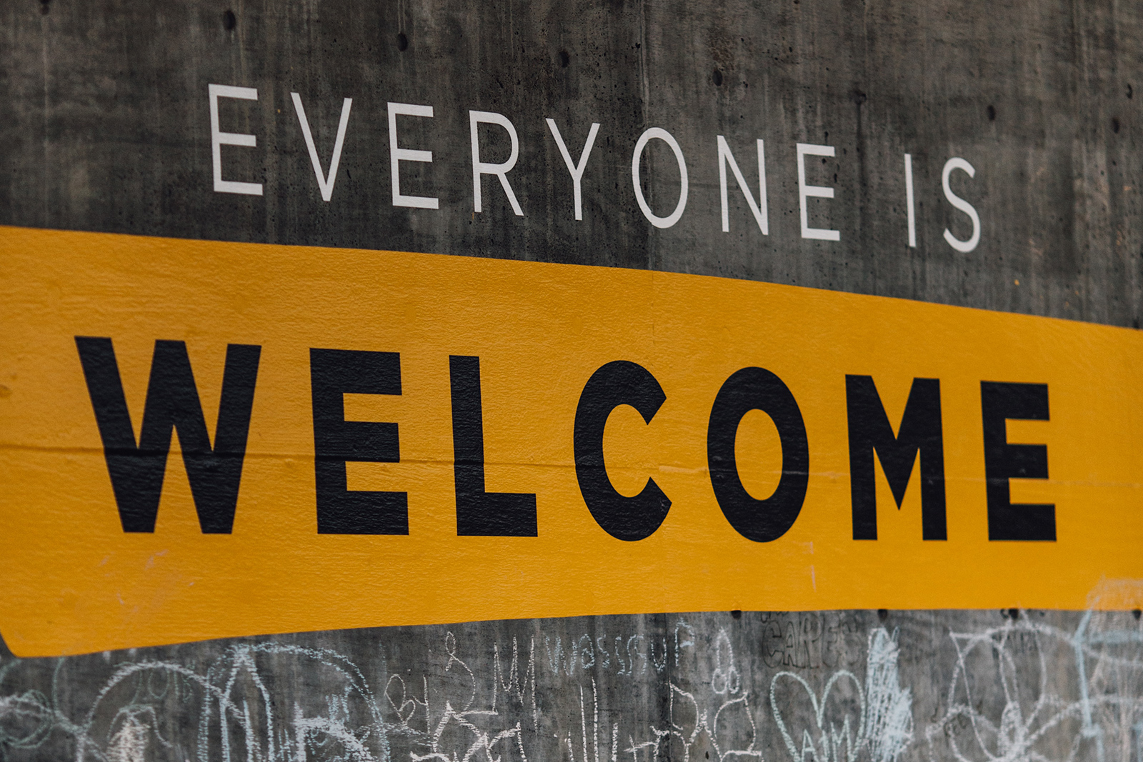 Everyone is welcome written on a wall