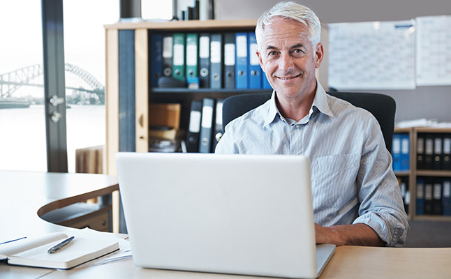 Professionals in Sydney office discussing a business case