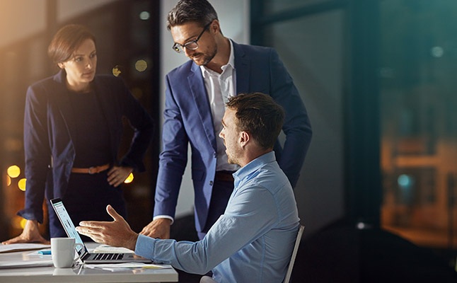 Professionals in Sydney office discussing a business case