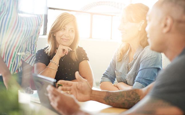Professionals in Sydney office discussing a business case