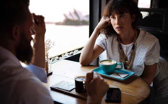 Professionals in Sydney office discussing a business case