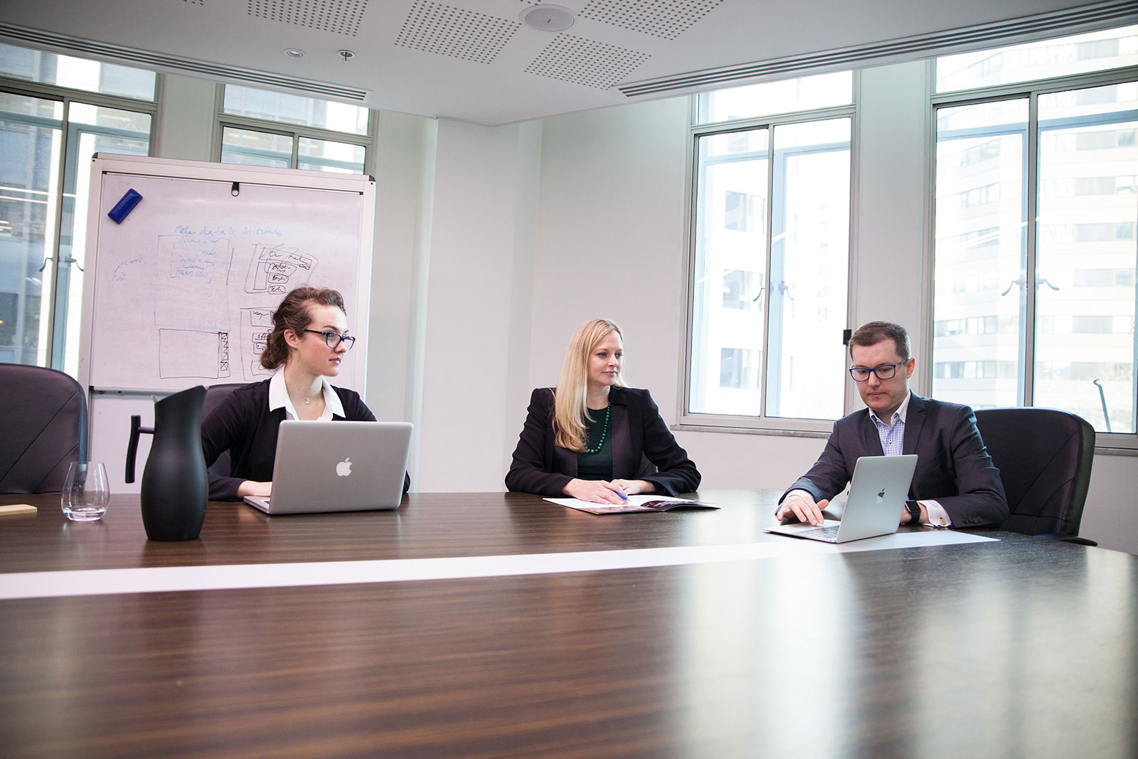 Website professionals working on a website document