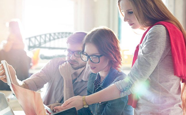 Professionals in Sydney office discussing a business case