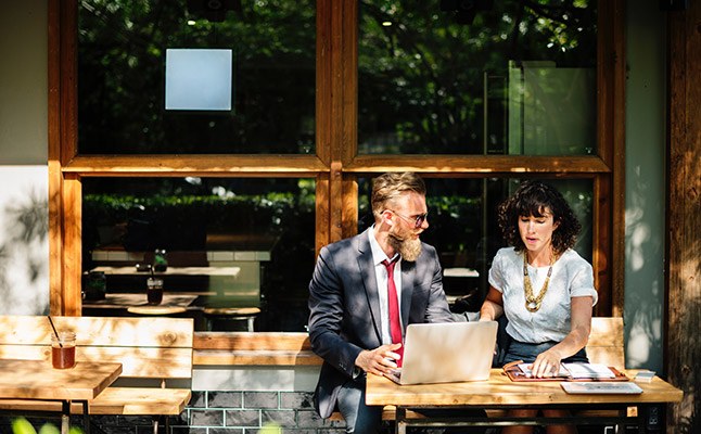 Professionals in Sydney office discussing a business case