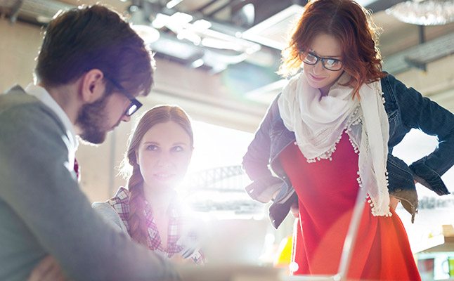 Professionals in Sydney office discussing a business case