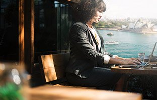 Professional business woman in Sydney working on her website