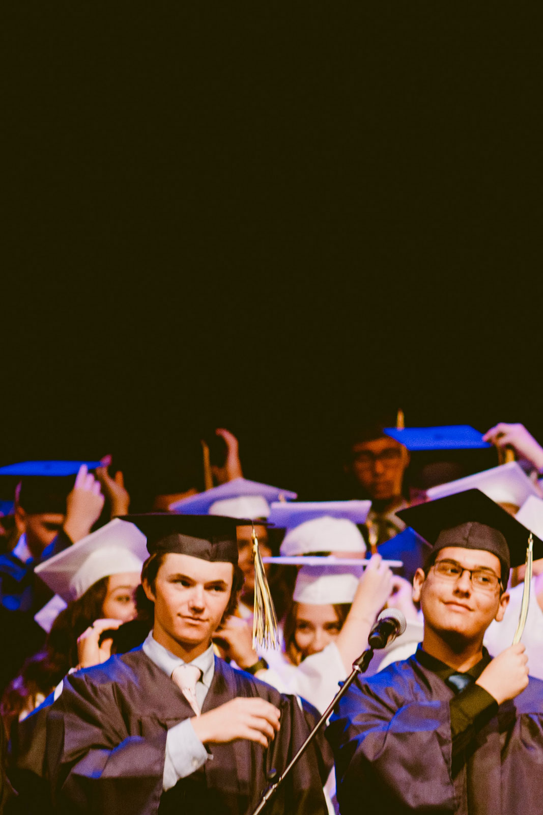 A class graduating from college and celebrating 