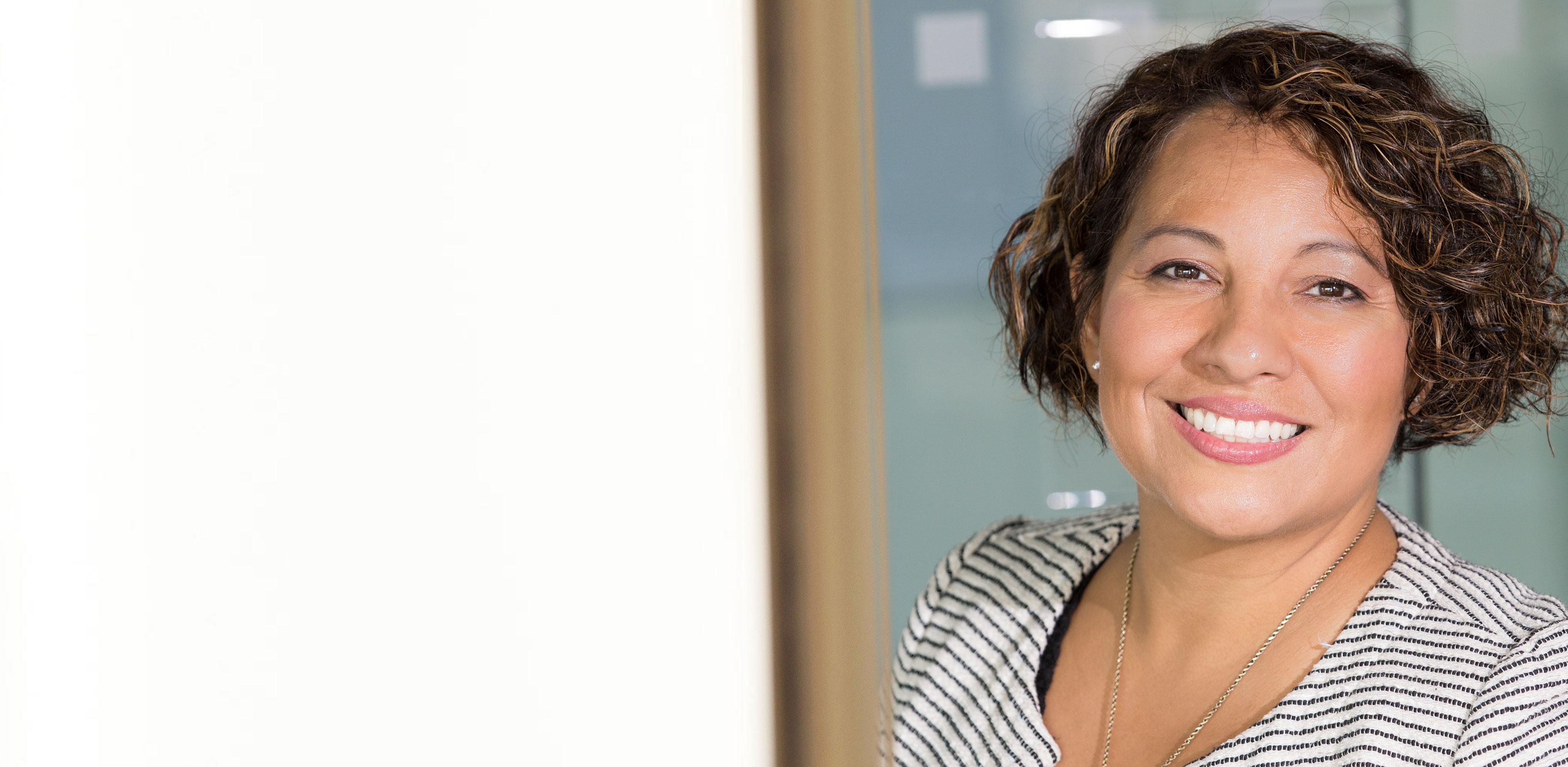 Professional women in an office, smiling