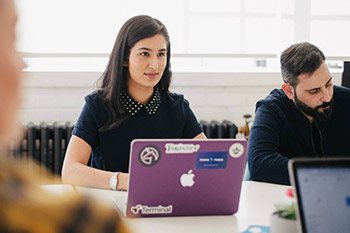 Professionals using a website brief generator in their office