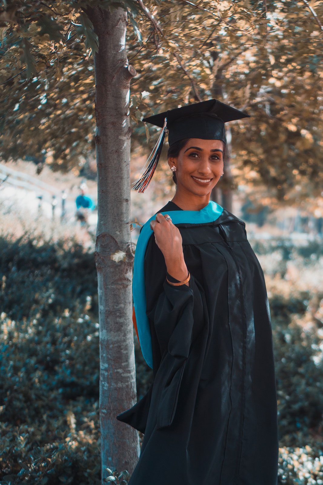 Woman on a sunny day in graduation gown