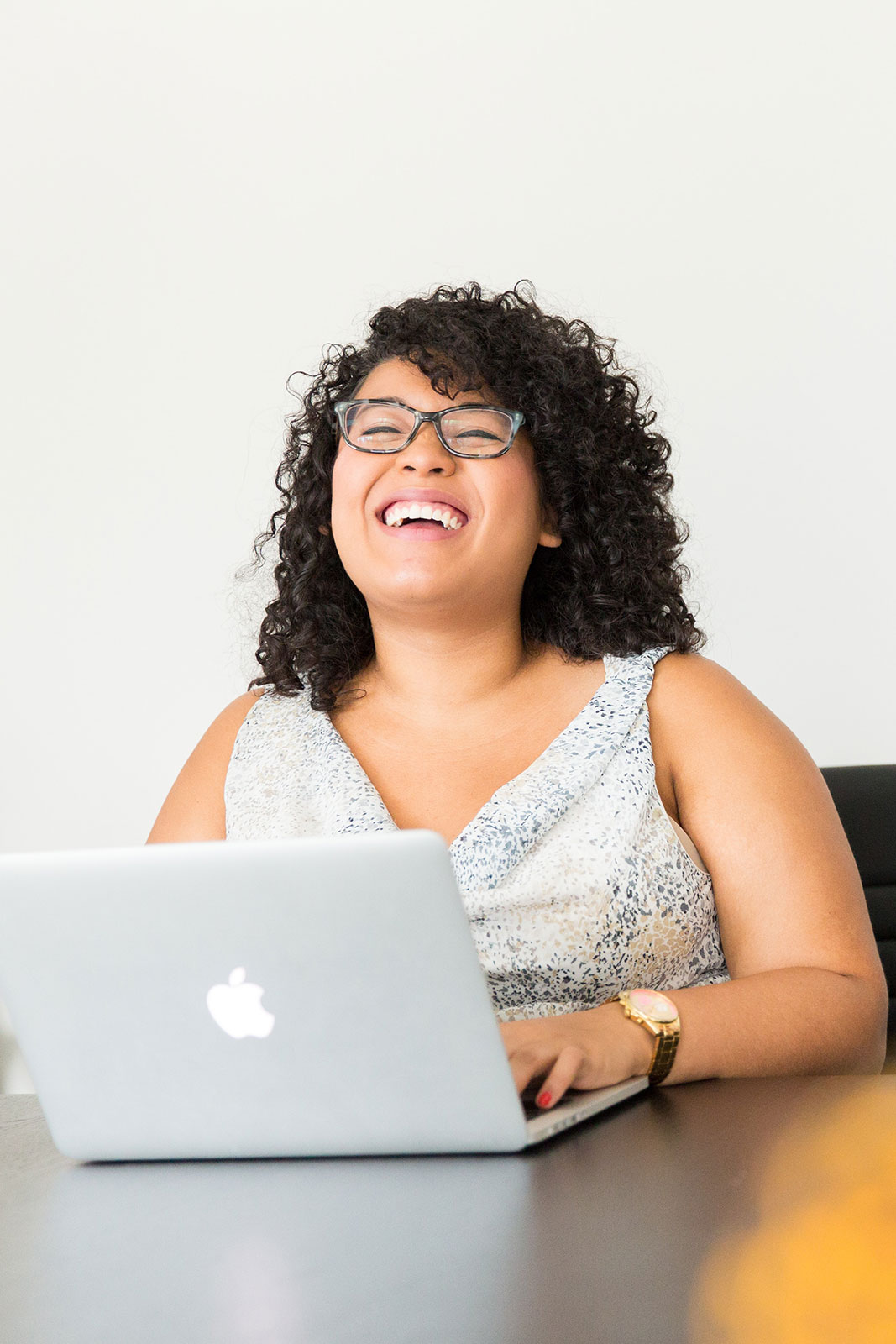Professional woman in a office laughing