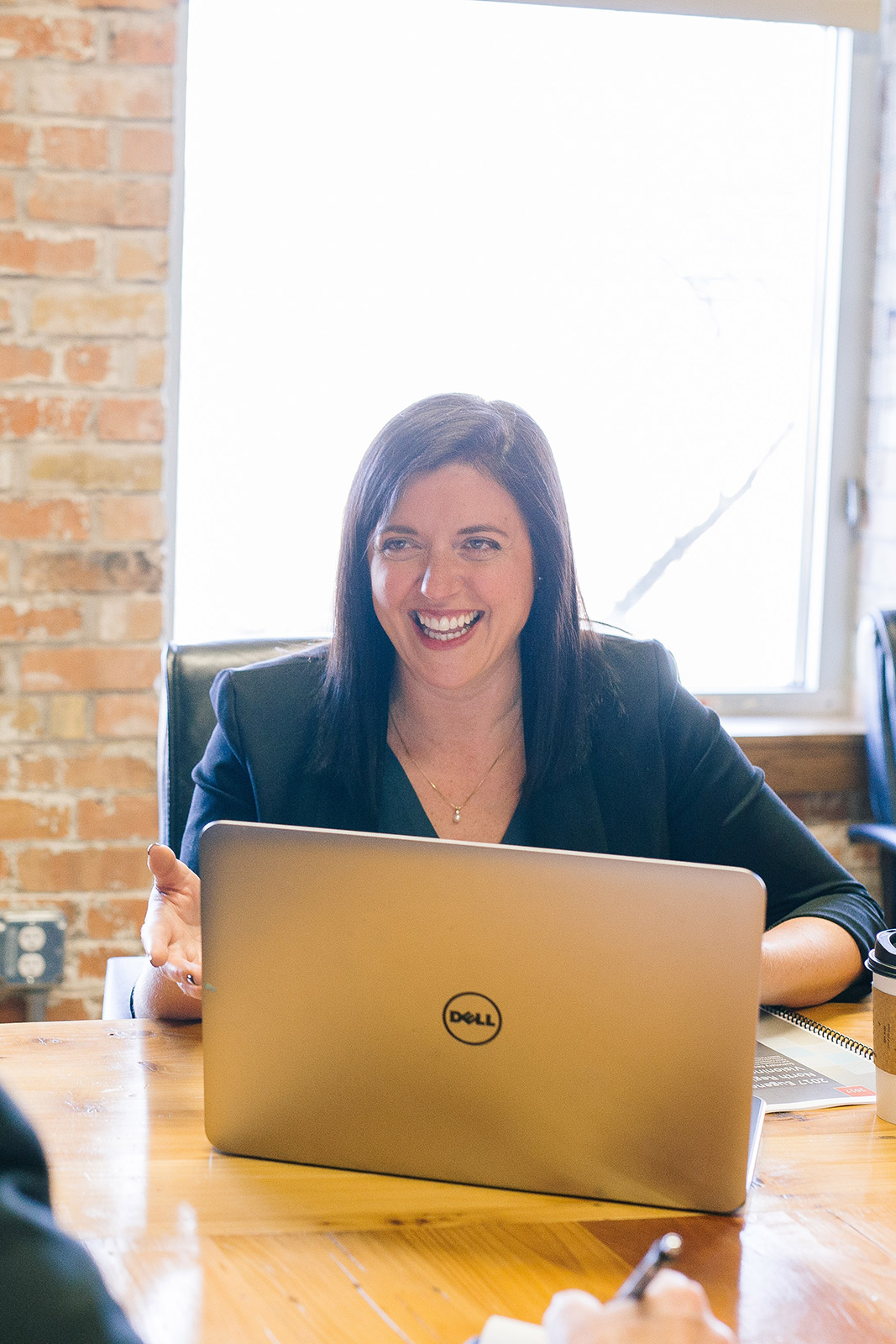Professional woman in office discussing a business case for a new website