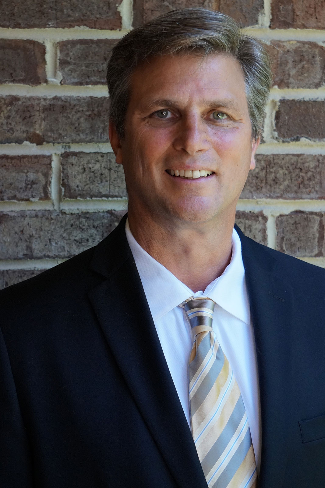 46 year old man in a suit