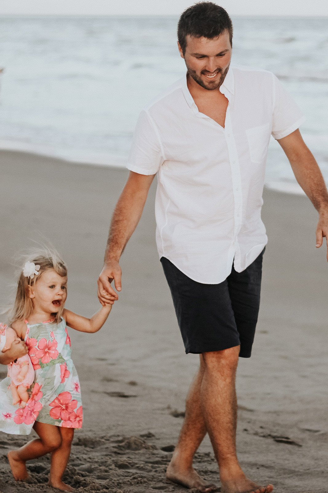Father with daughter at the beach